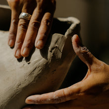 Load image into Gallery viewer, Hands shaping clay during a team-building activity in Montreal, perfect for corporate groups and bachelorette party.